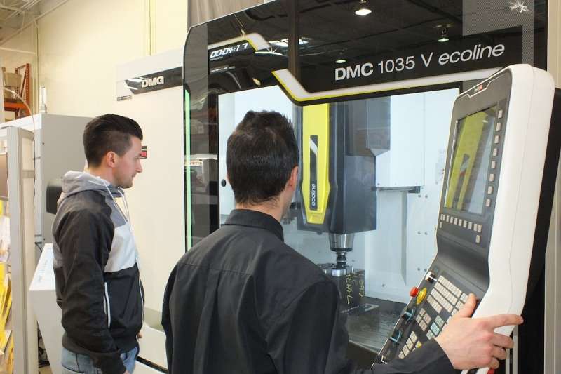 Giovanni Bruno, JM Design, examines the DMG MORI machine he's considering purchasing.