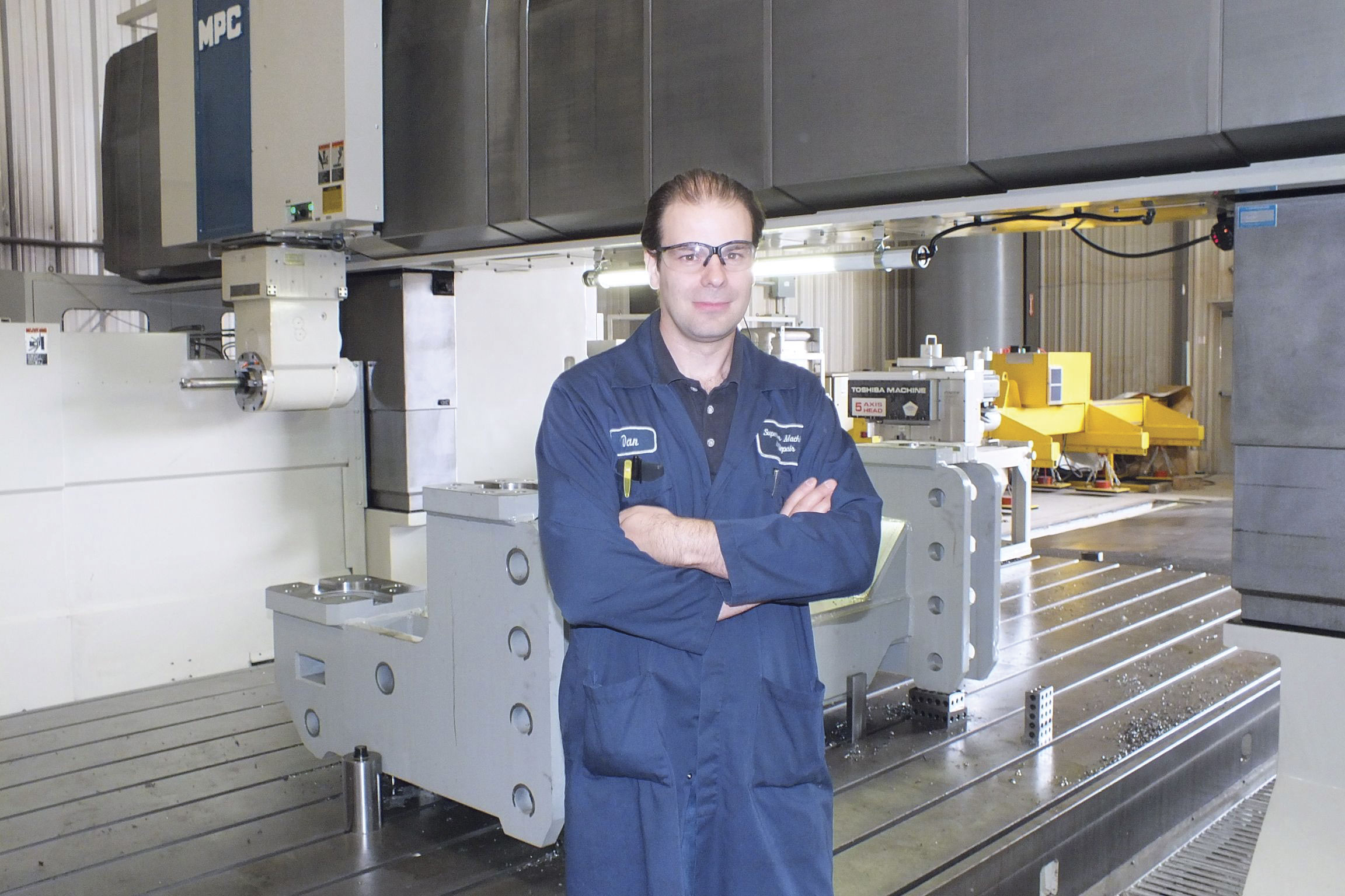 Dan Boaretto believes in taking calculated risks if you want to grow a machine shop business; hence the purchase of the large Toshiba machine, seen behind him.