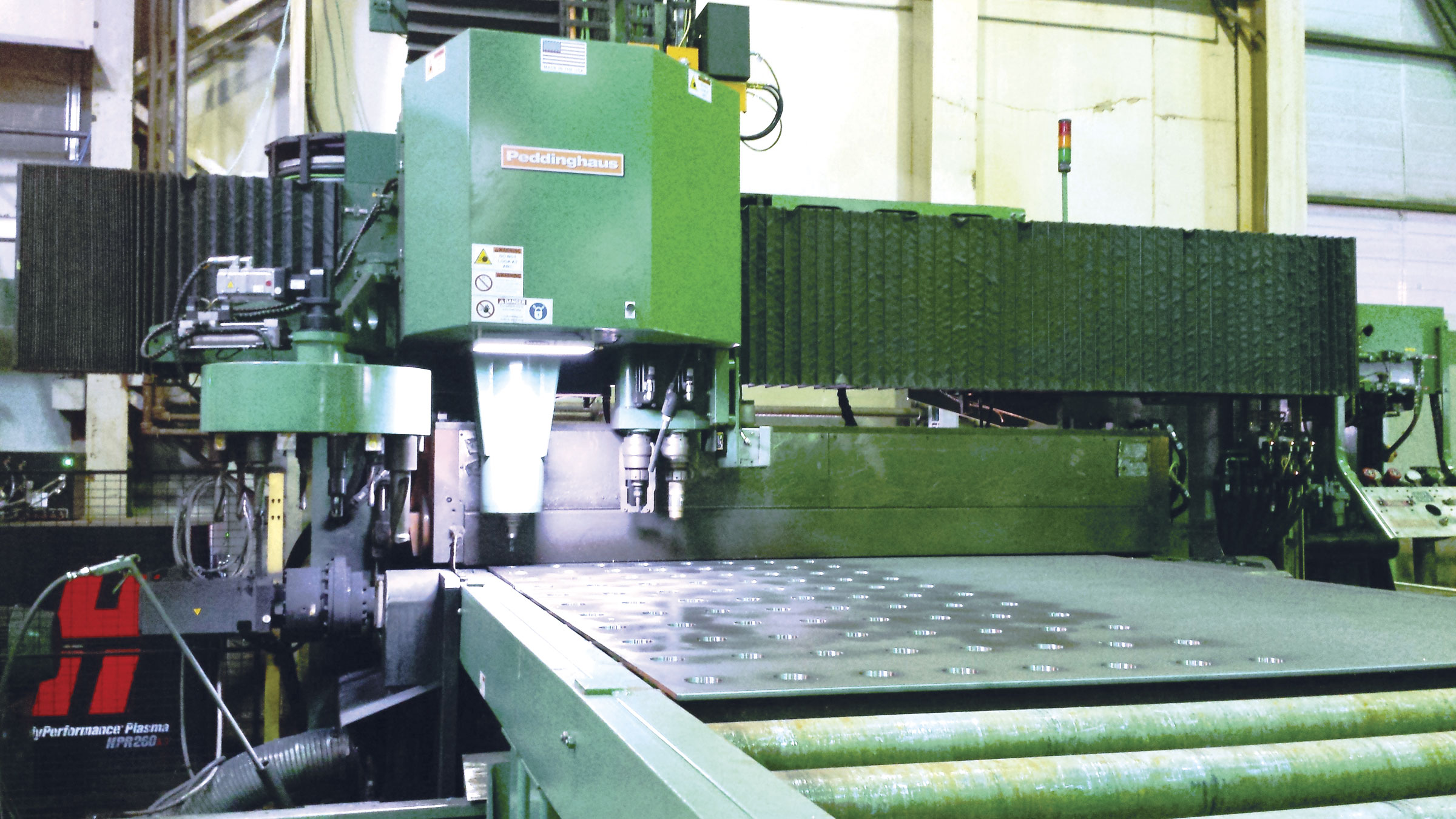 The Peddinghaus plate processing machine in Ocean Steel & Construction's shop handles plate stock up to 76 mm (3 in.) thick in sizes 2400 mm (96 in.) wide by 6000 mm (240 in.) long.