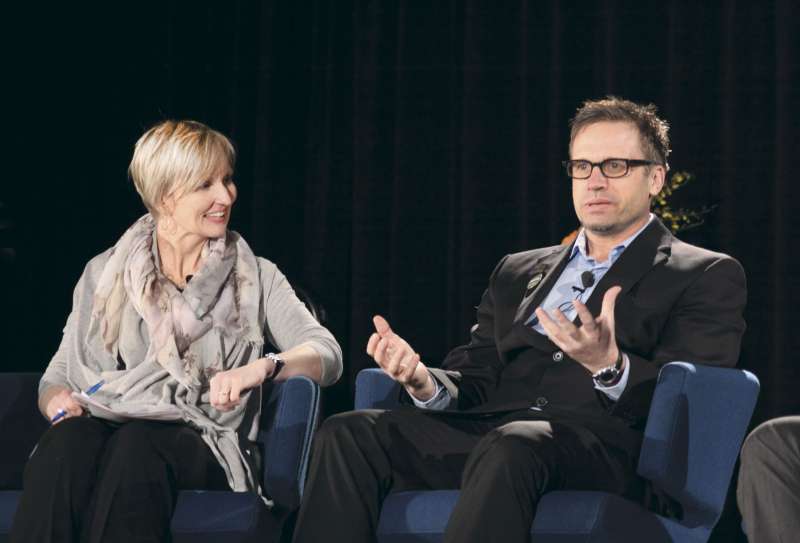Arto Tienaho, right, told his personal story of mental illness at the 2014 Bottom Line conference on workplace mental health. Left is Kathryn Gretsinger, conference MC.