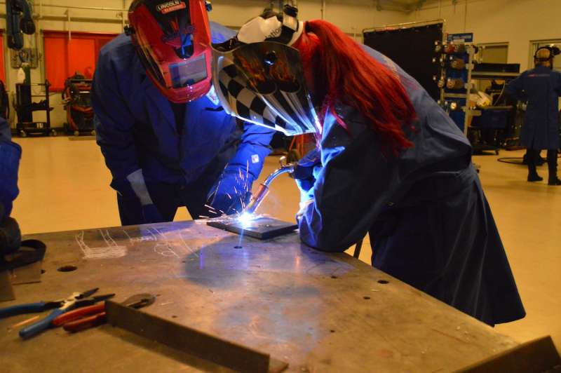Heather Tarnawski, 17, a Grade 12 robotics student from M.M Robinson High School practices MIG welding. 
