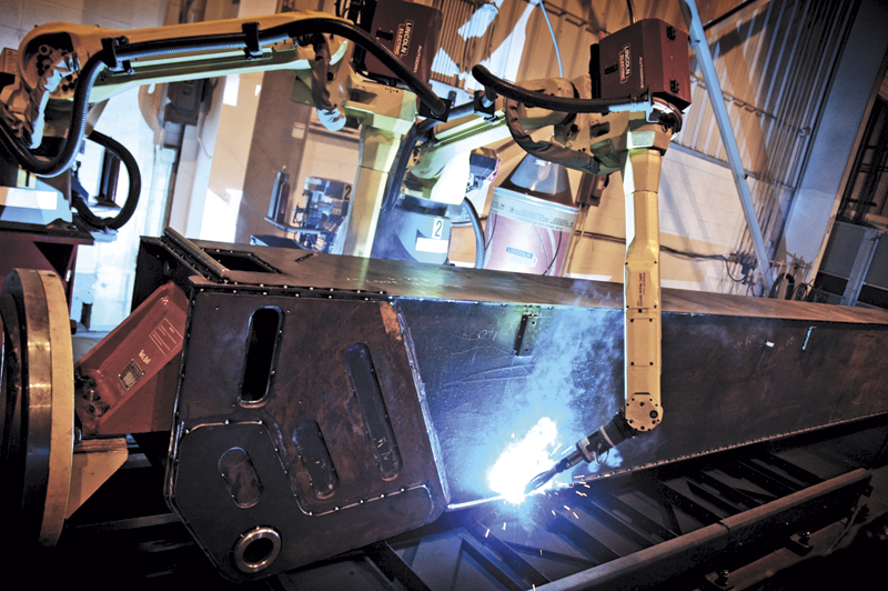 The Edmonton plant has achieved manufacturing efficiencies through robotic welding, including the use of this Lincoln boom welder.