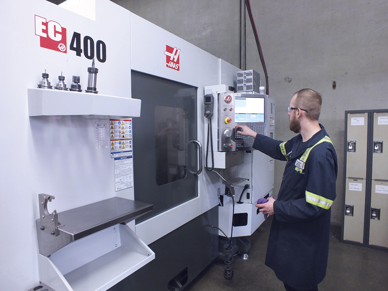 Machine operator Geoff Kehler makes adjustments on a Haas machine equipped with Iscar tools