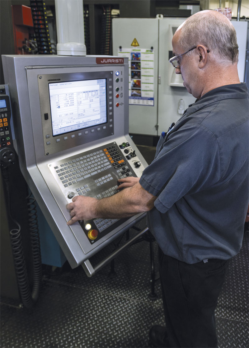 Machine operator Mike Repuski at the Heidenhain controls on the Juaristi machine. 
