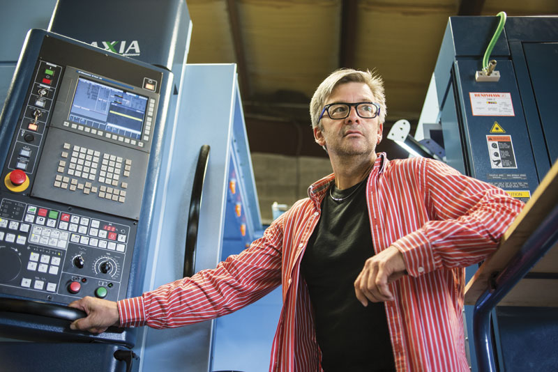 Carl Hungerbuehler beside one of the five axis Matsuura machines. Hungerbuehler has invested more than $2 million to re-equip ELPA's operation to improve productivity and to grow.