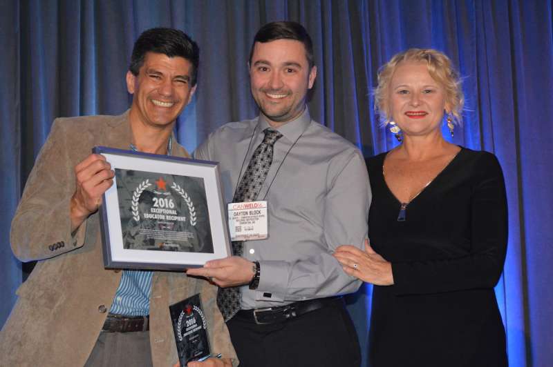 From left: Patricio Mendez, recipient of the Michael N. Vuchnick Award, Dayton Black, recipient of the secondary school award for educators and Deborah Mates of the CWA Foundation 