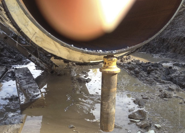 Magnetism in pipe welding can lead to big weld problems. Left: Magnetized pipe in Fort McMurray, AB.   Images: Western Instruments