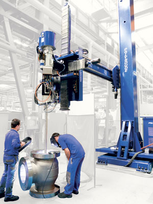 Polysoude's weld cladding system with the SPX welding head. Cladding in the horizontal vertical position on large sized cylindrical workpiece.