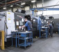 Forty Doosan CNC machine tools fill the production floor at Hydra Dyne Technology.