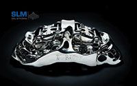 A Bugatti brake caliper built on an SLM500 quad laser is one example of the larger workpieces it is now possible to build additively. Titanium, build time 45 hours.