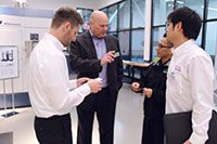 Matsuura’s Thomas Houle discusses Lumex technology with his colleagues. Matsuura Machinery